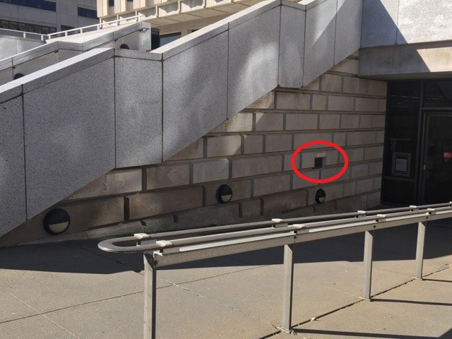 Hillman Library's Bookdrop, located outside of the entrance doors, is highlighted with a red circle.