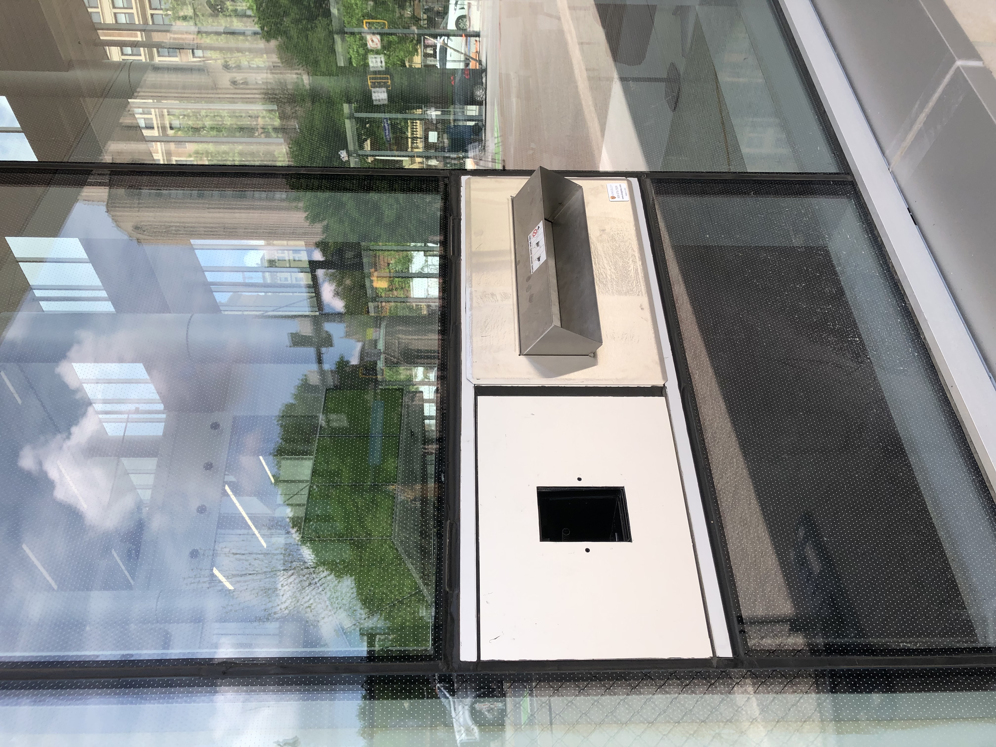 Close-up of someone using Hillman Library's bookdrop