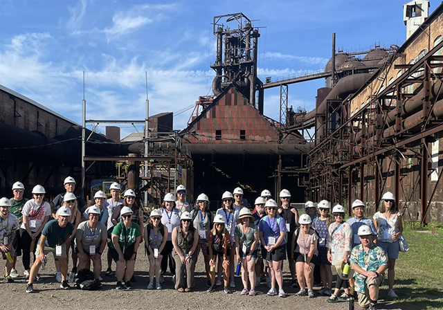 A cohort for one of the 2024 workshops for The Homestead Steel Strike and the Growth of America as an Industrial Power program stands in front of the Carrie Blast Furnaces.