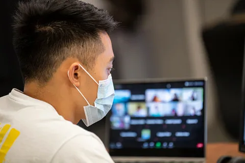 Student looking at virtual meeting