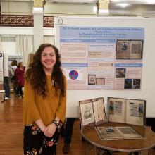 Claudia Haines with poster and other materials